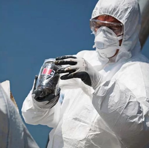 the waste group employee removing asbestos