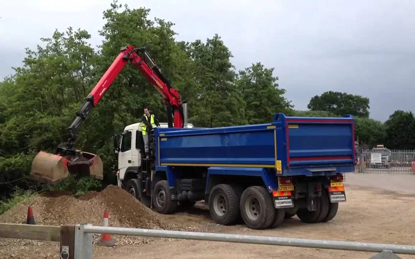 a grab lorry loading gravel