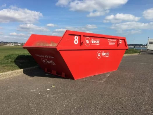 a red waste group skip