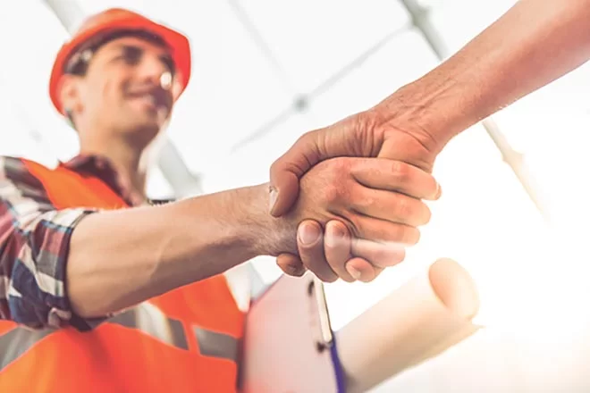 construction worker shaking hands