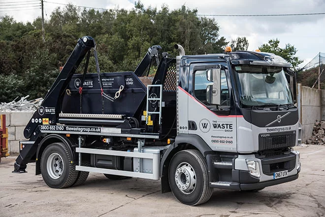 The Waste Group truck collecting a skip