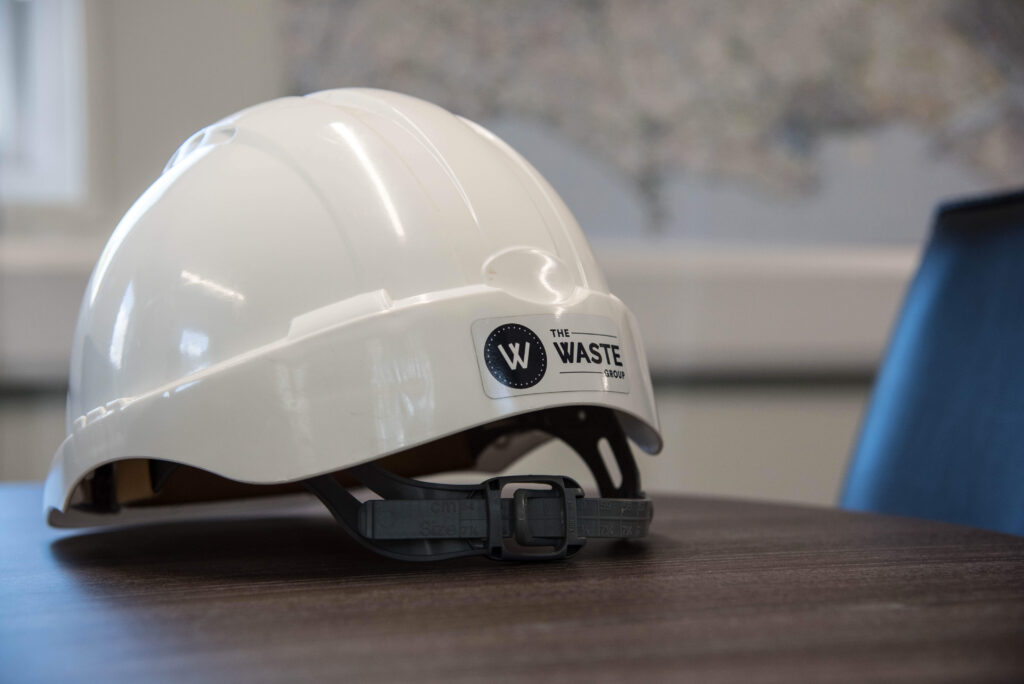 a white helmet with the waste group logo