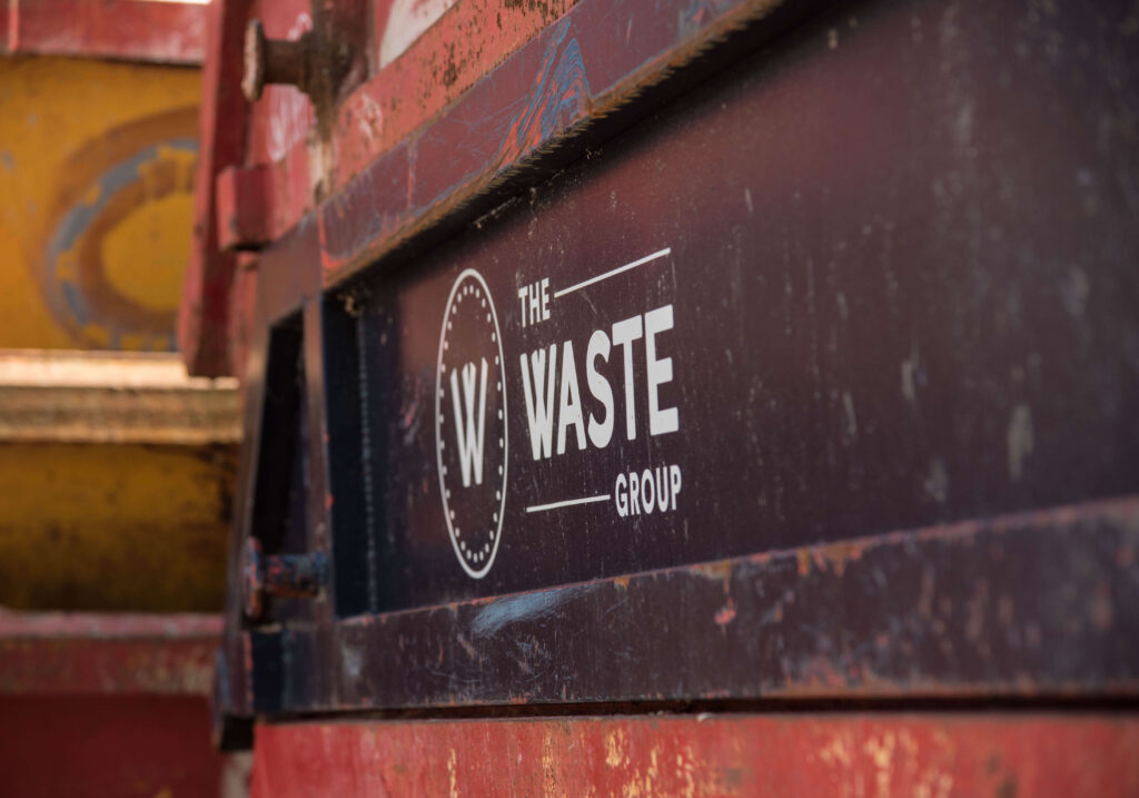 a container with the waste group logo