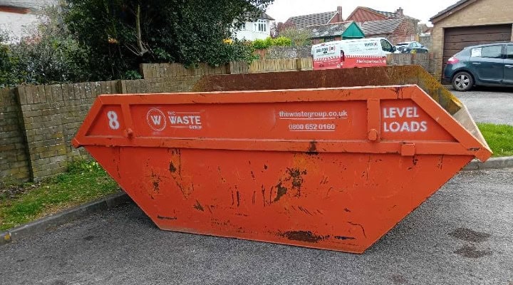 Skip hire Weymouth — 8 yard skip on a residential driveway, The Waste Group